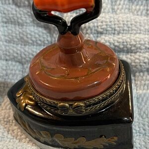 Small trinket box in the shape of an old Iron with Orange and Black Design